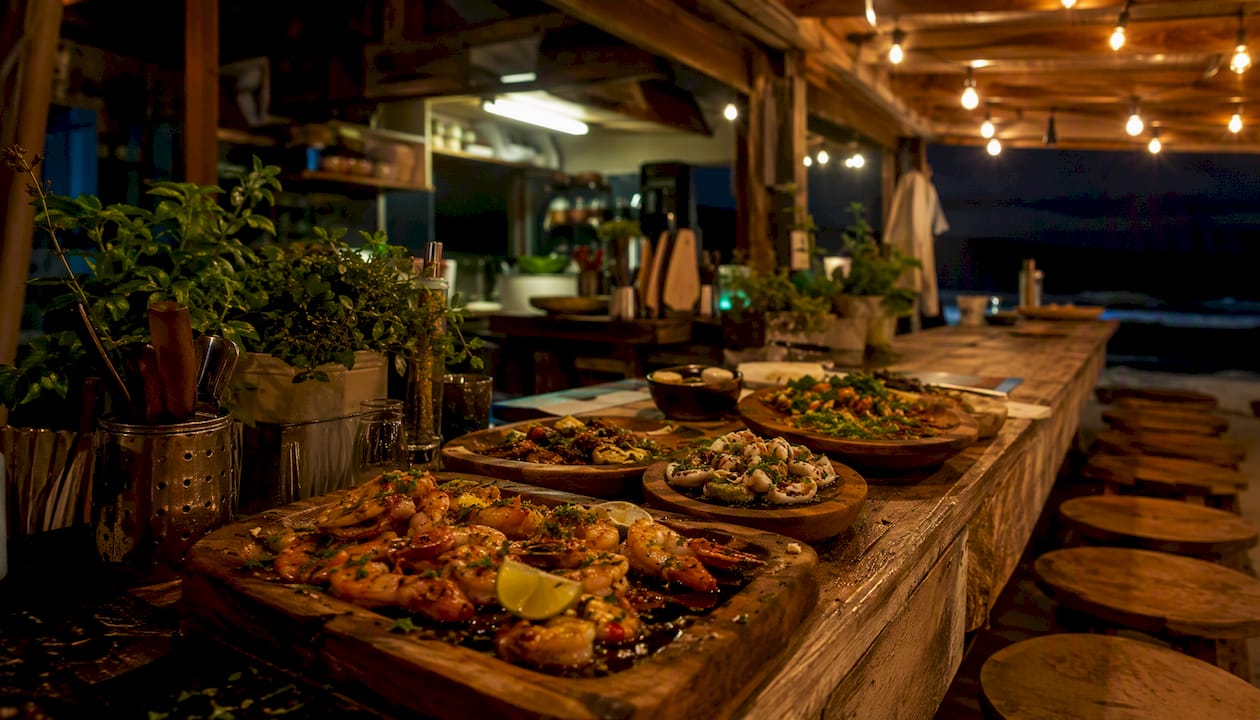 Seafood petiscos and açaí bowls at small beach bar kitchen