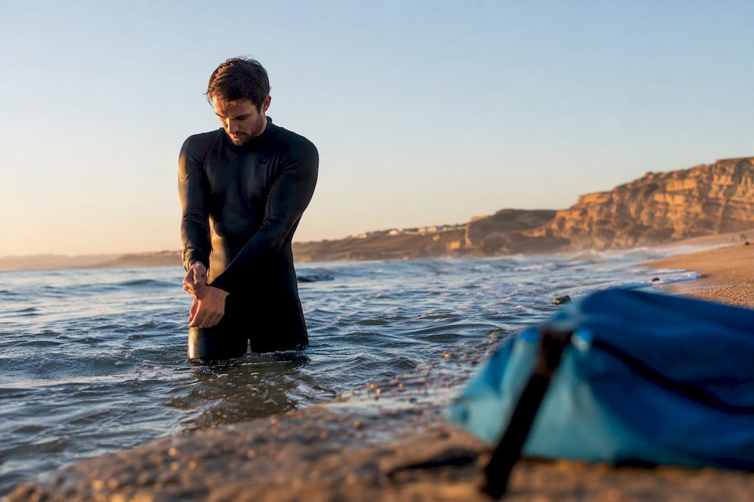 Surfer preparing for cold Portuguese water