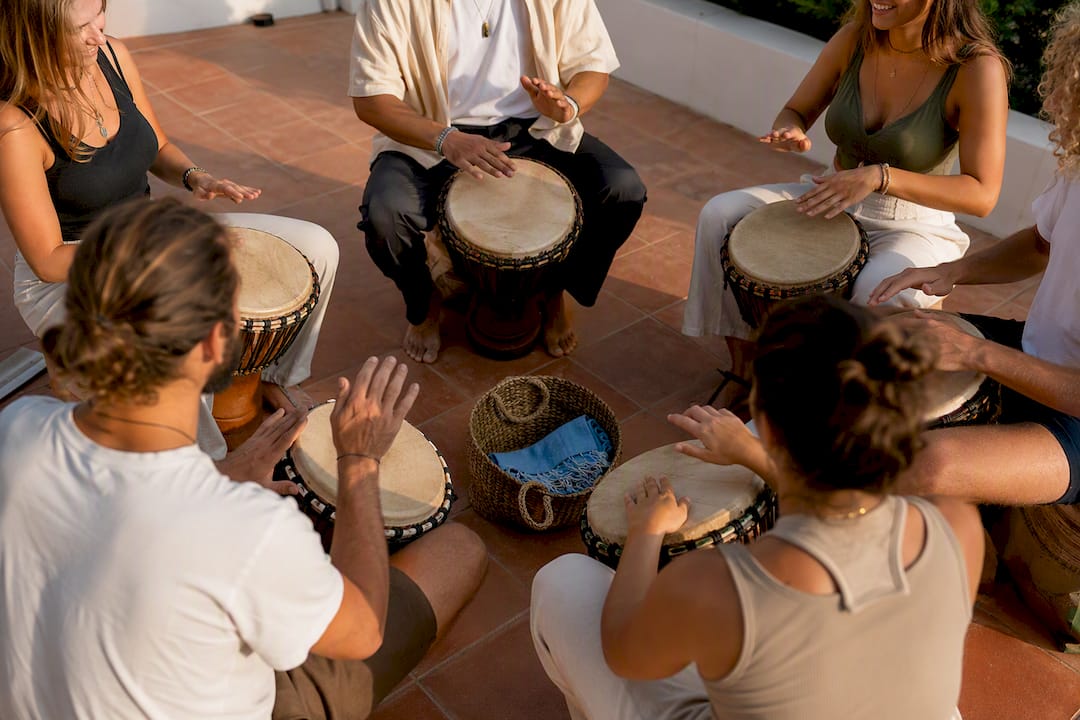 Campers participating in Portuguese drumming workshop