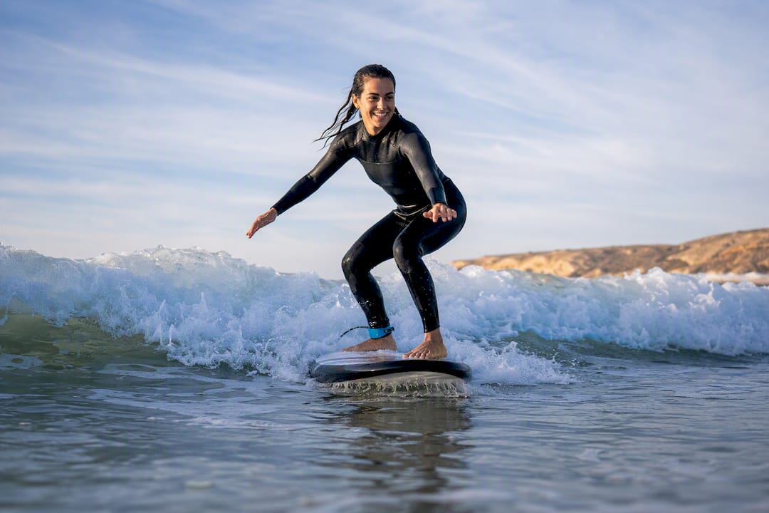 Beginner surfer standing on whitewater wave