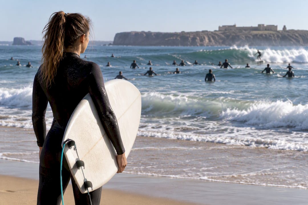 Surfer assessing a crowded beach break