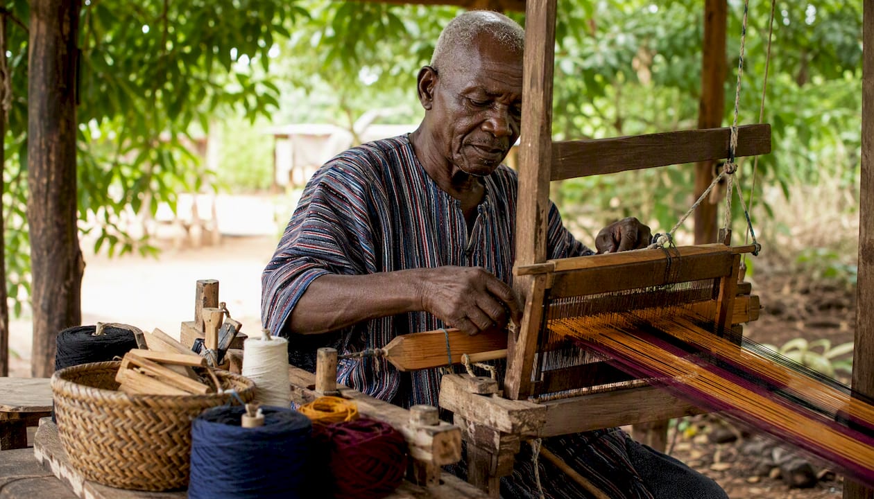 Close-up hands weaving narrow textile strips