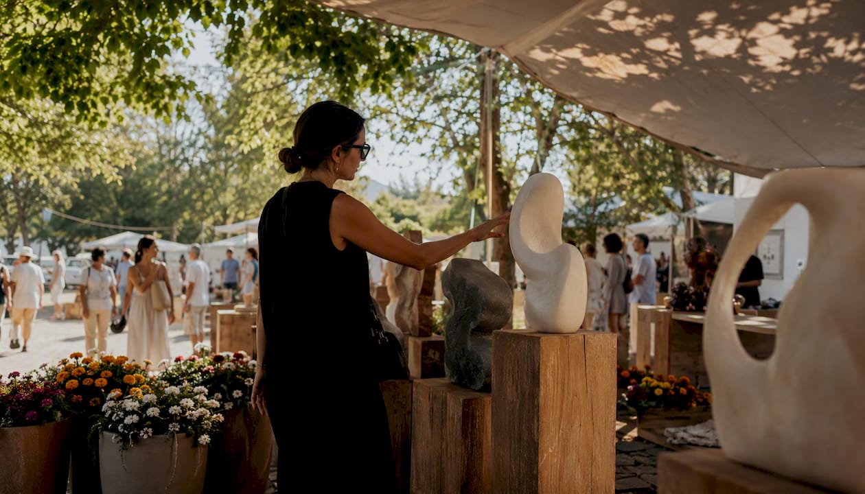 Curator selecting fresh art outdoors