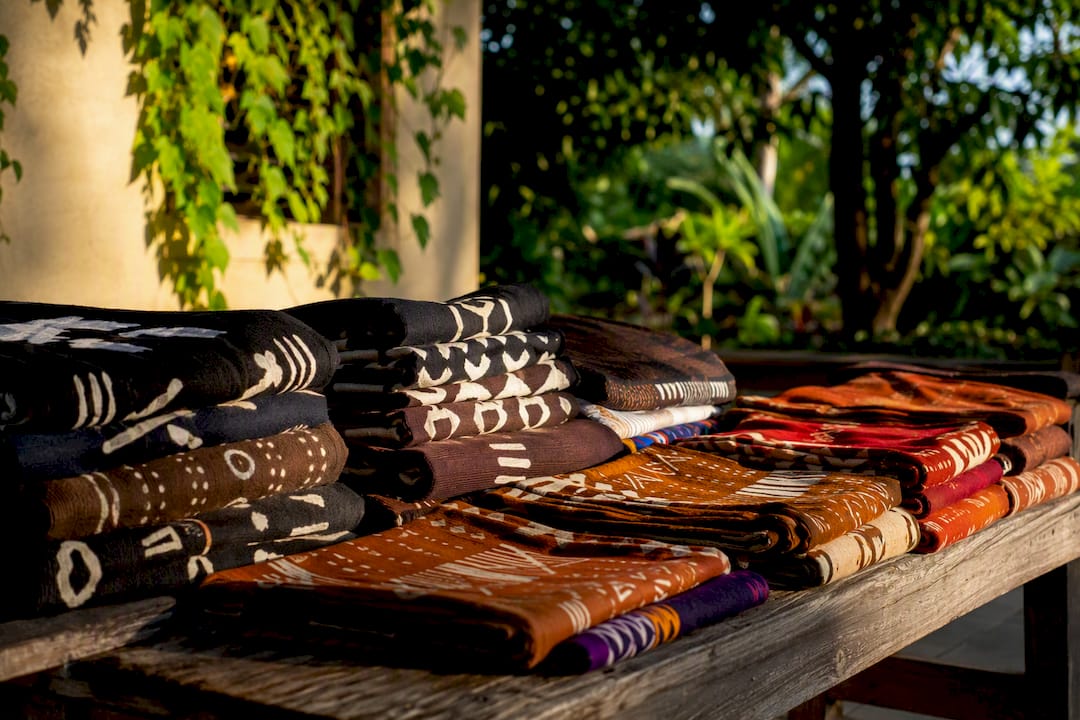Folded Adinkra cloth in funeral and festive colors