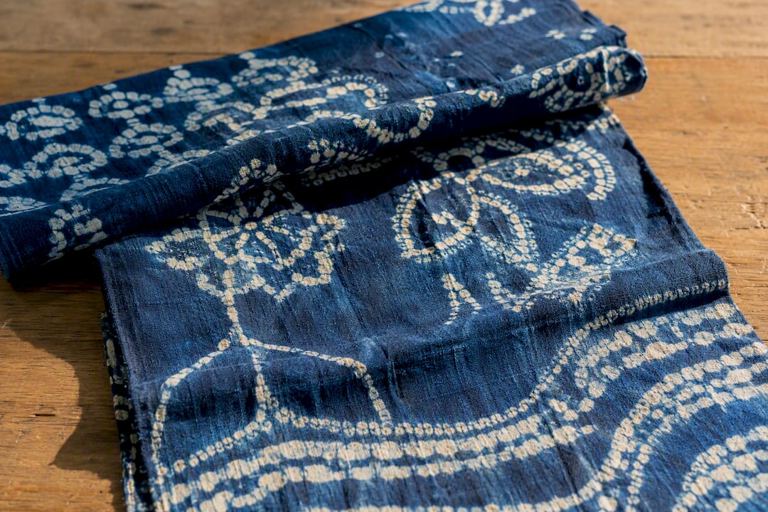 Close-up of indigo adire cloth with Yoruba designs