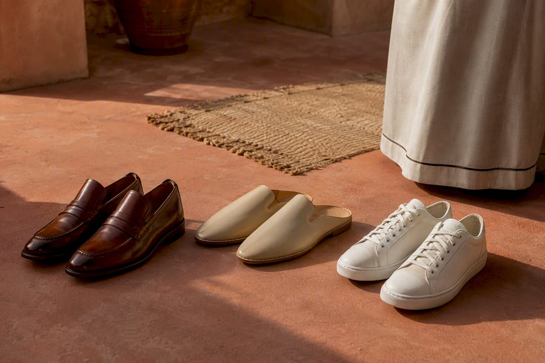 Loafers babouche and sneakers beside kaftan hem