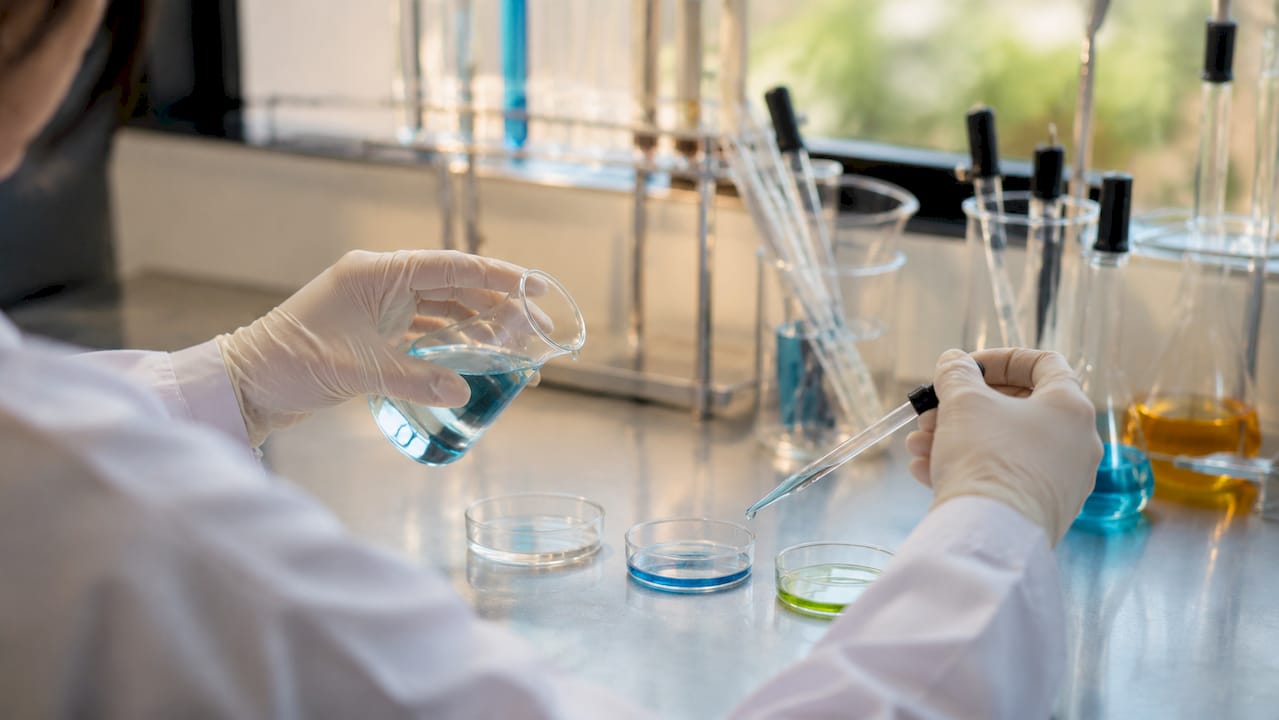 Scientist handling skincare clinical trial samples