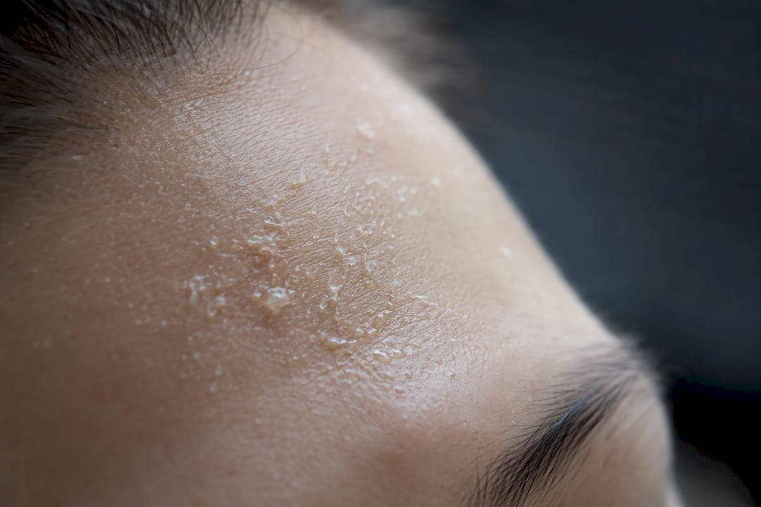 Peeling gel forming clumps on skin close-up