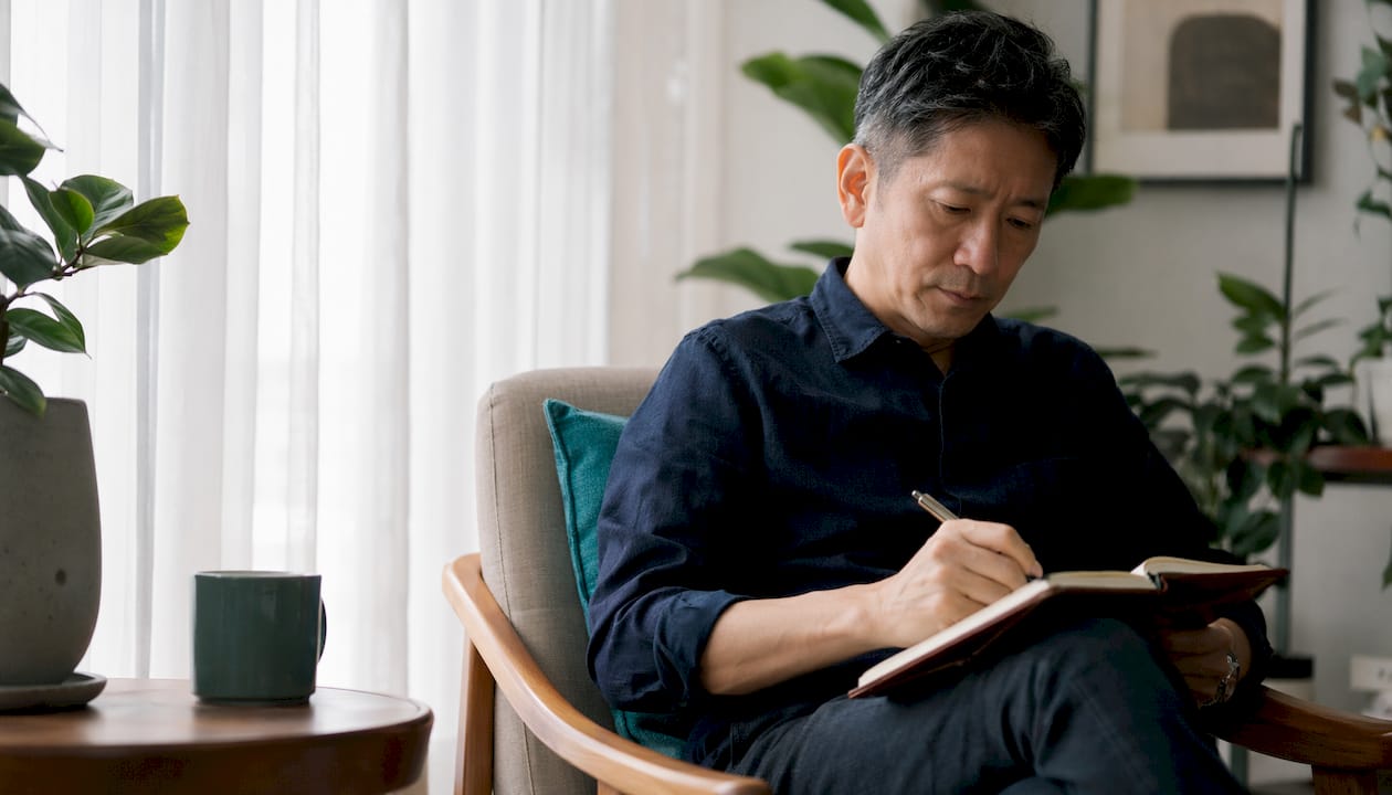 Hands using laptop for employee recognition platform