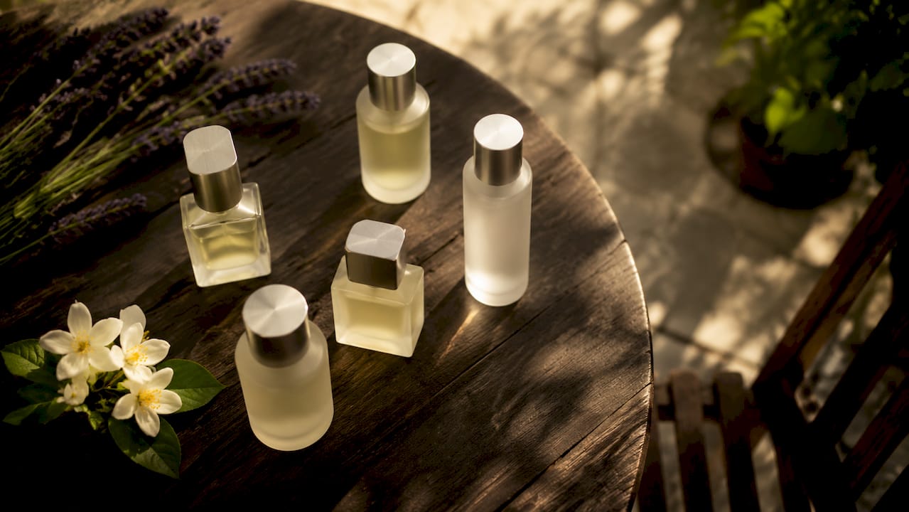 Minimalist clean fragrance bottles on marble