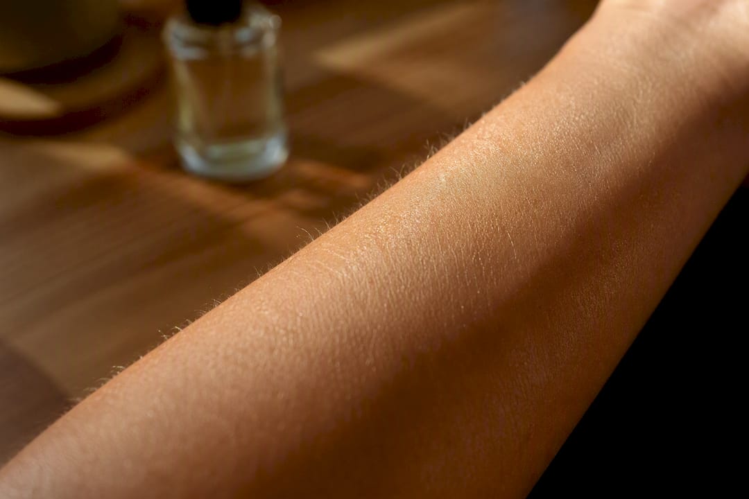 Close-up of moisturized forearm skin texture