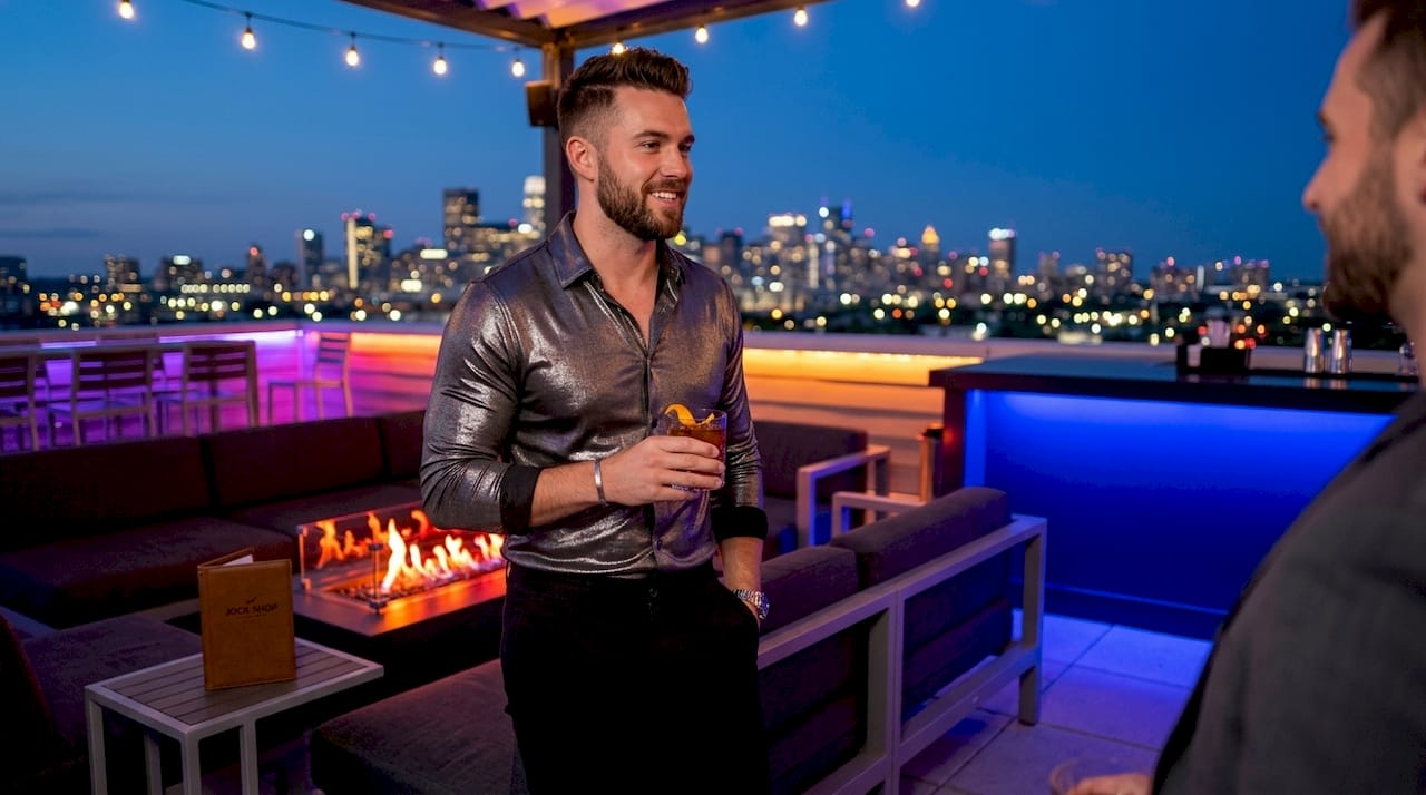 Man wearing stylish clubwear in upscale nightclub lounge