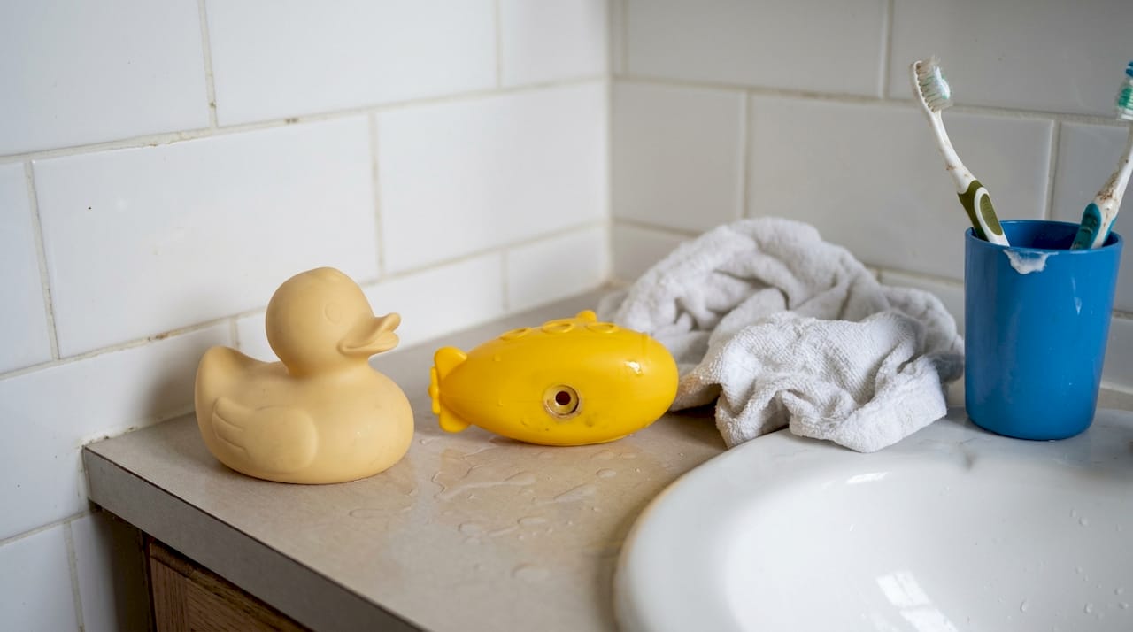 Natural rubber vs plastic bath toys on sink