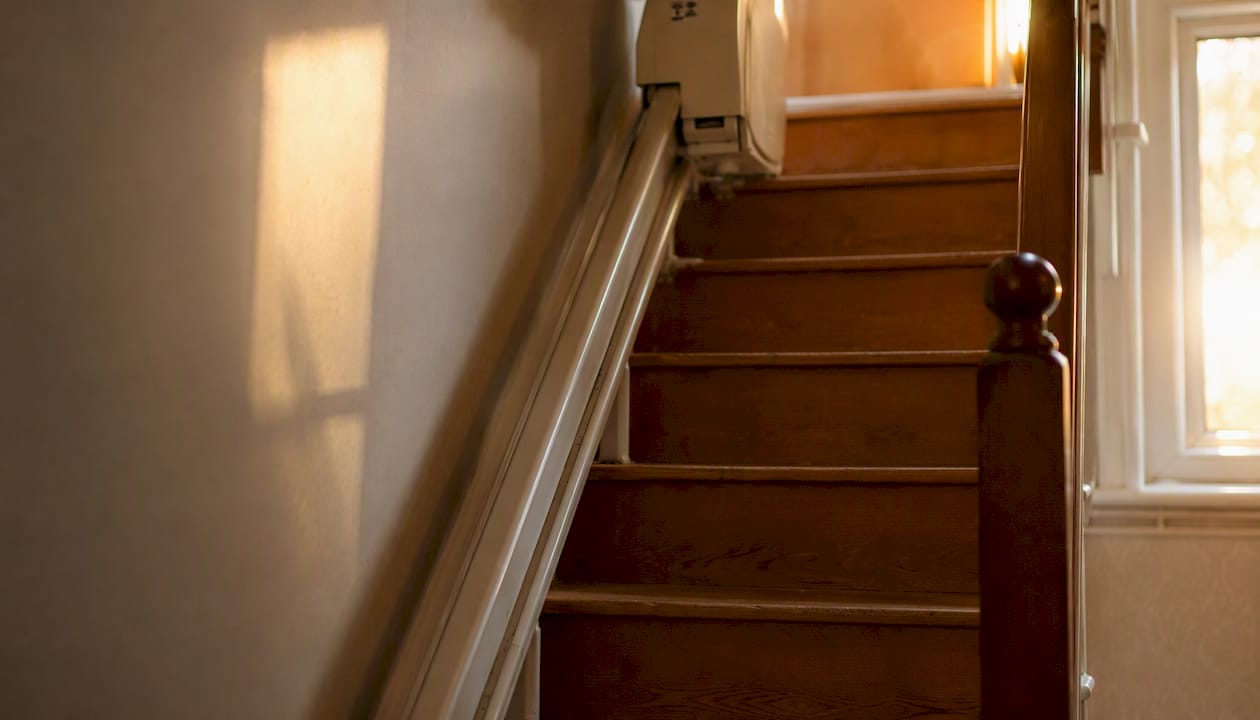 Close-up of stairlift rail reducing stair width