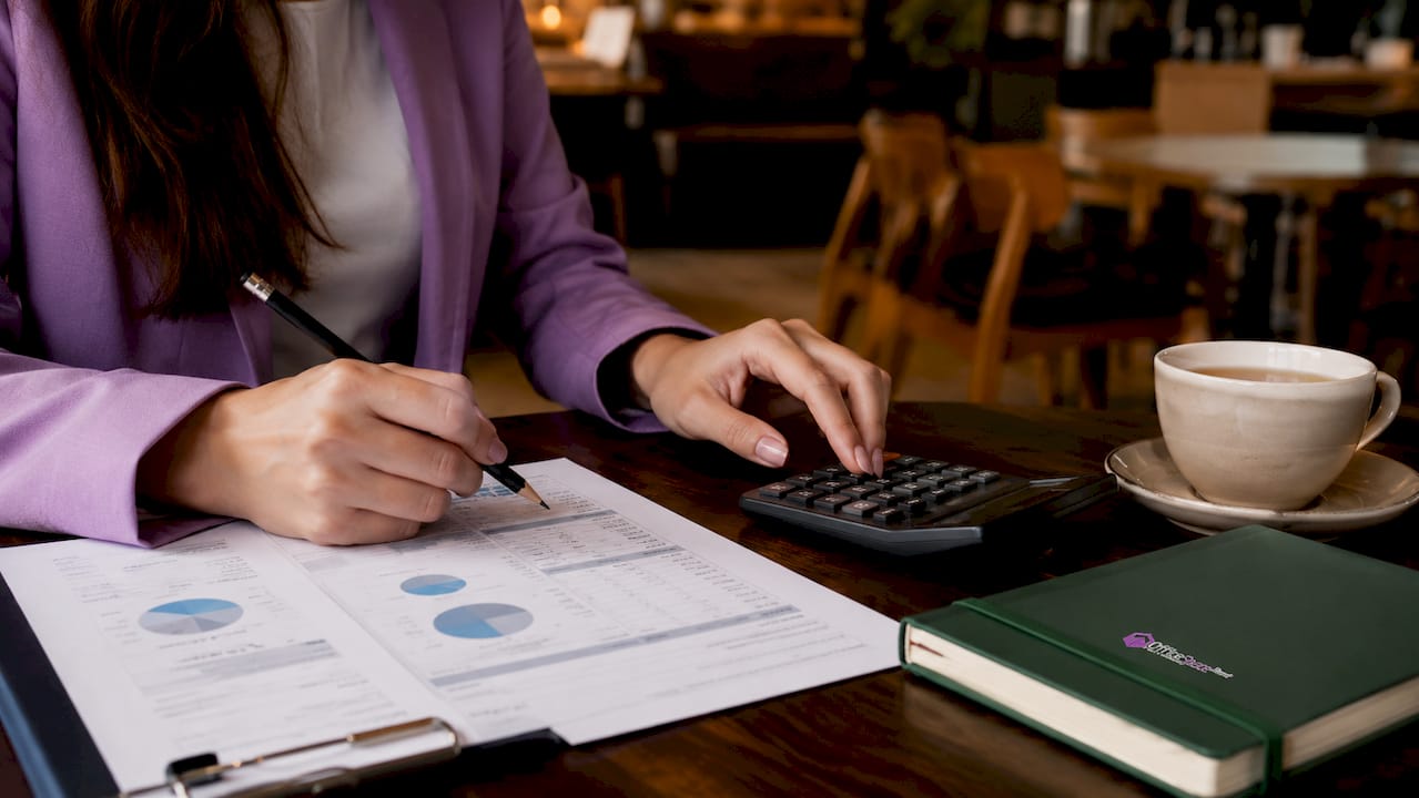 Close-up of hands calculating lease costs