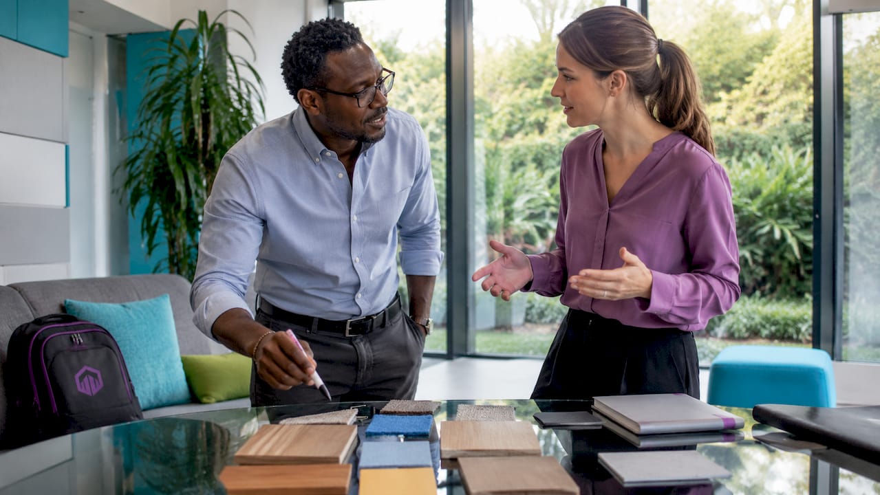 Colleagues collaborating on office brand elements