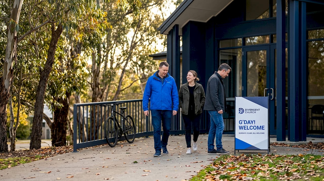People arriving at welcoming Canberra church entrance