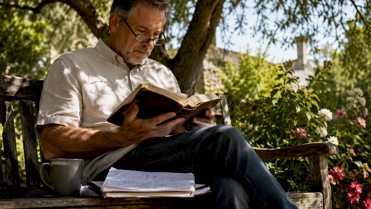 Pastor reading Bible in church office