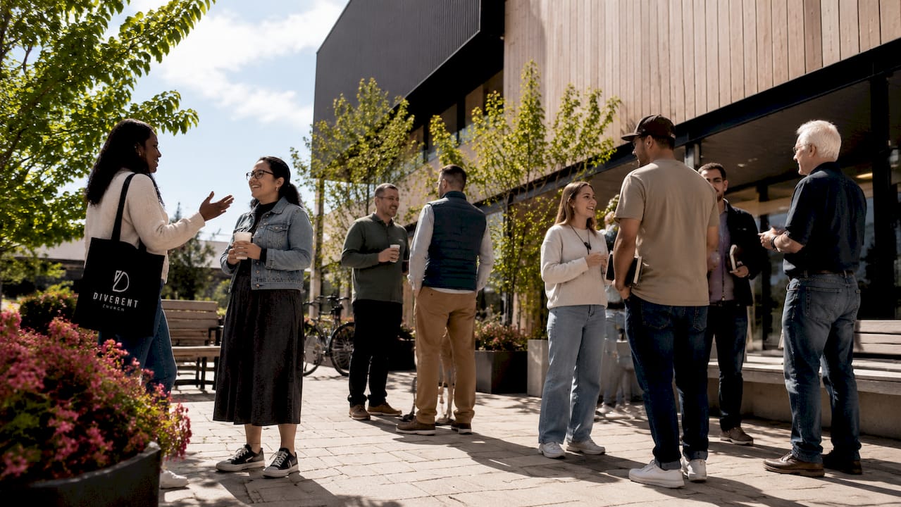 People gathering outside Tuggeranong church building