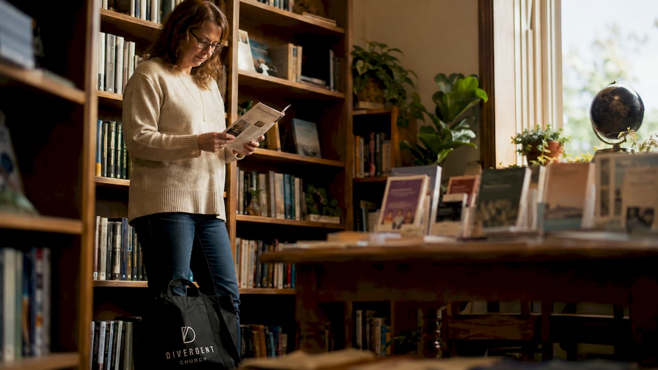 Woman reading church group listings