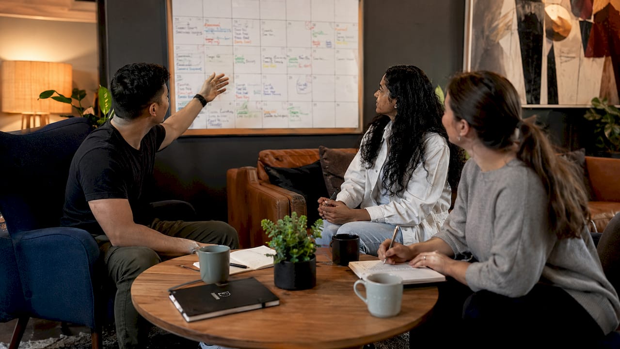 Volunteers planning church event timeline together