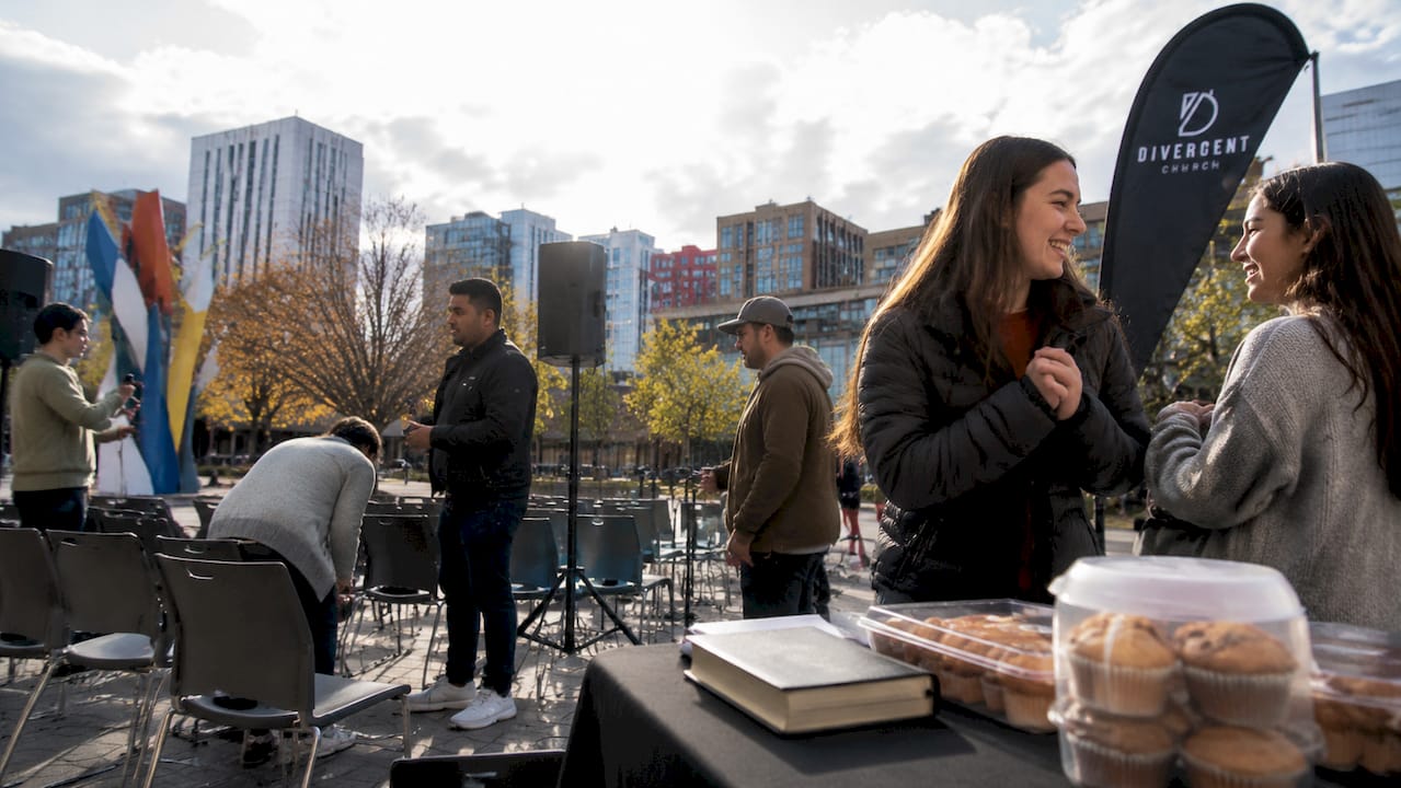 Community preparing for church planting event outdoors
