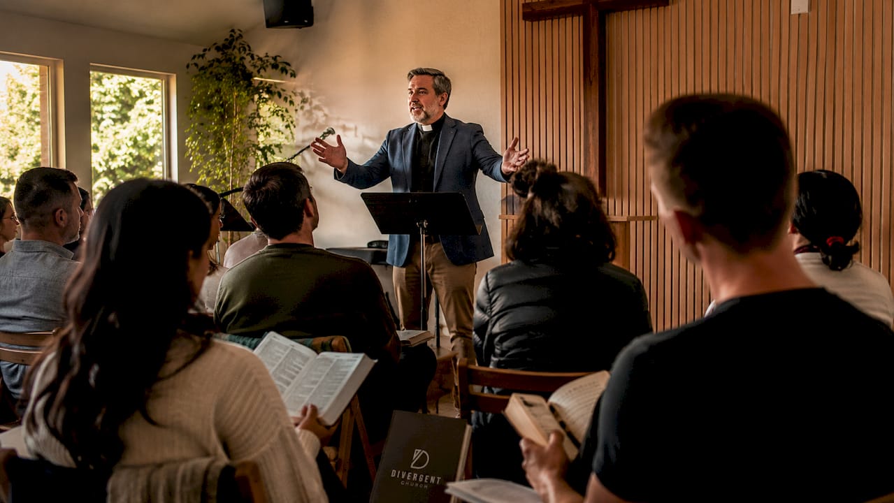 Pastor preaching to congregation inside church