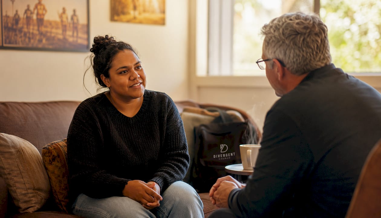 Woman meeting pastor for church membership testimony