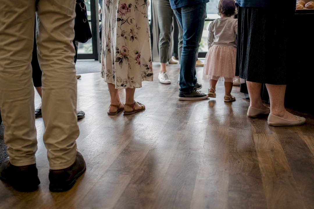 Mixed generation shoes in church foyer
