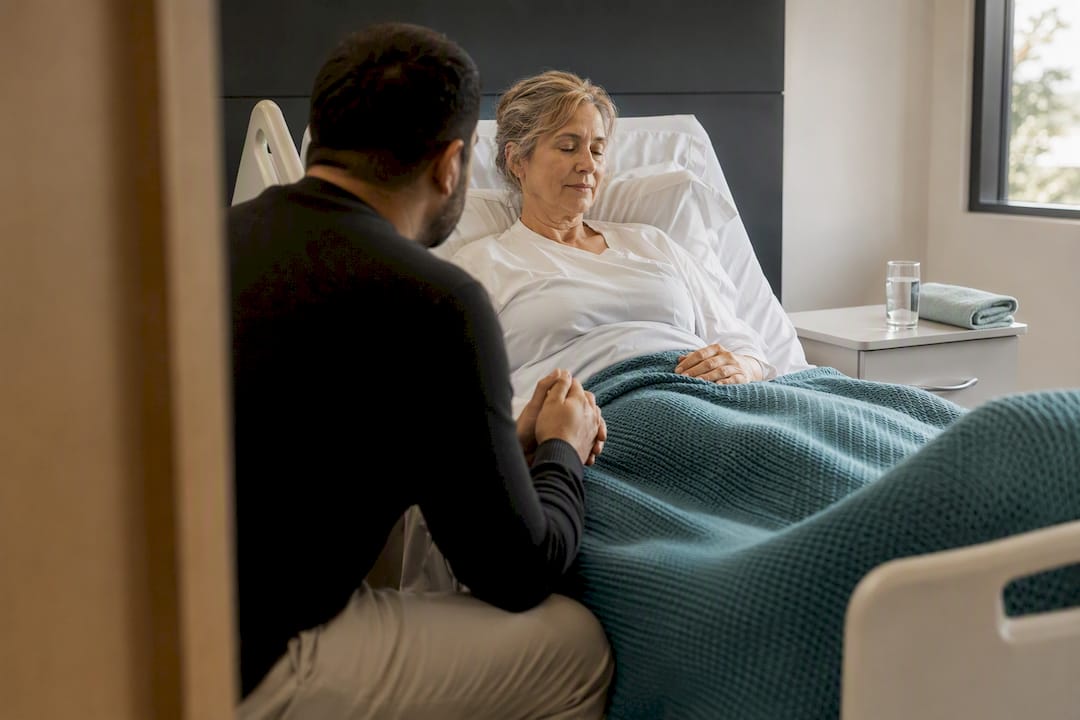 Quiet prayer beside a hospital bed