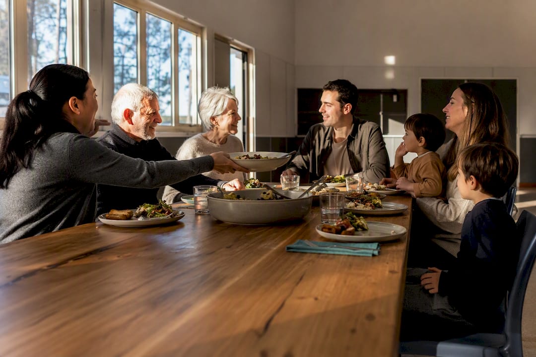 Intergenerational church family sharing a meal