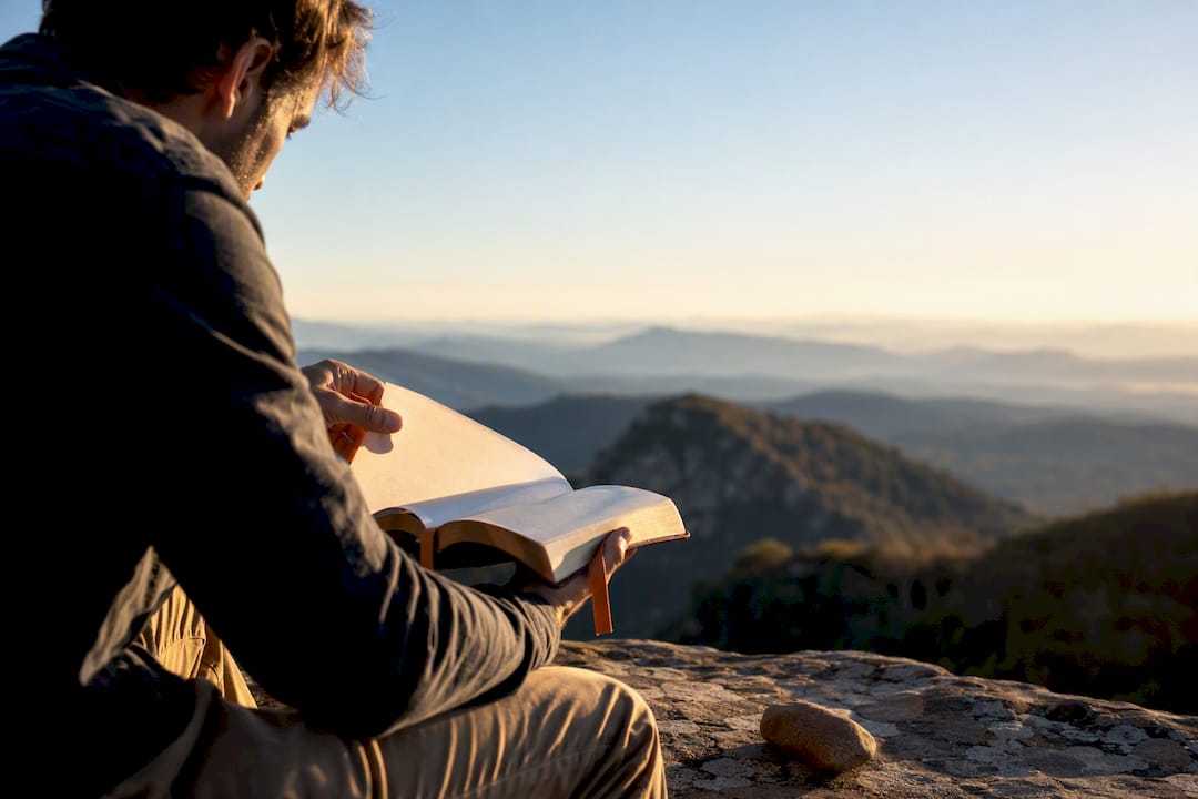 Reader studying the Sermon on the Mount outdoors