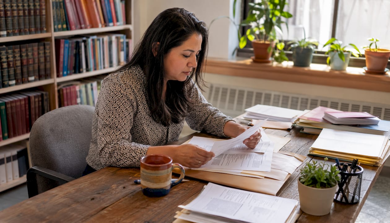 Woman reviewing immigration legal aid directories