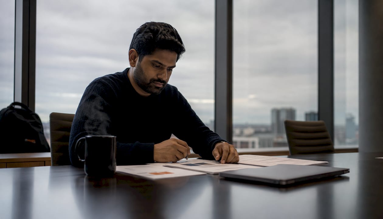 Cloud architect reviewing AWS security documents