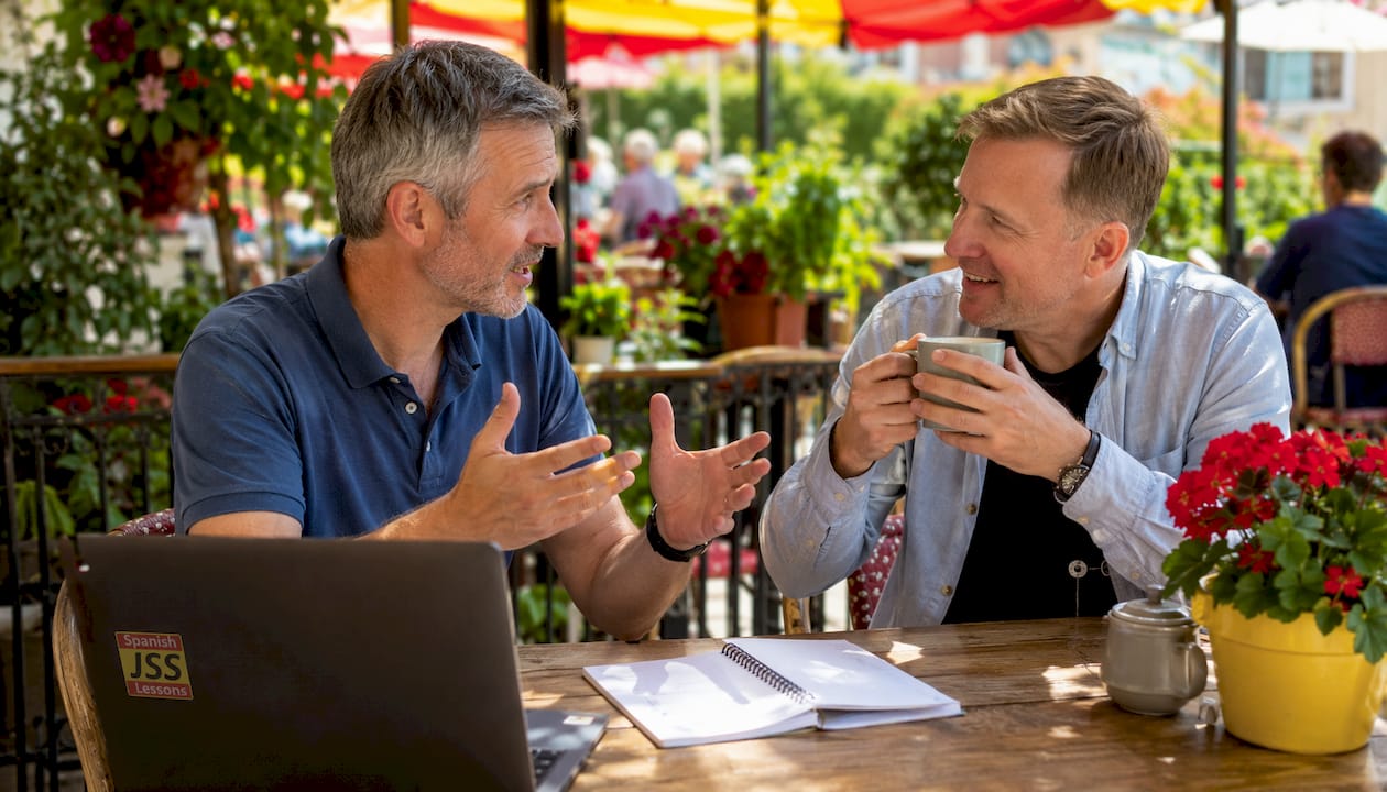 Two adult male expats practicing conversation in café