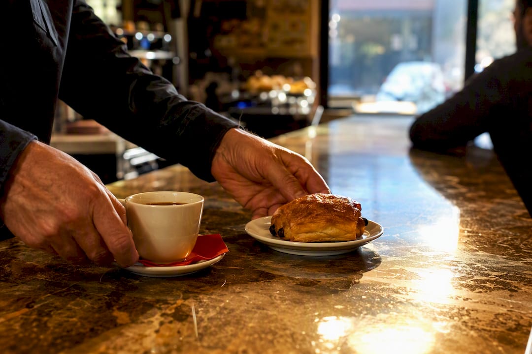 Coffee and pastry at Spanish café counter