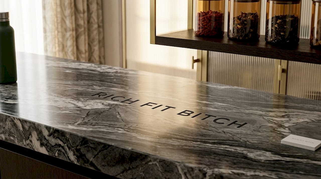 Woman prepping smoothie in home kitchen