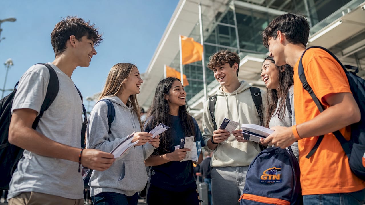 what is a travel protection plan? your 2026 guide 3 high school group waiting at airport gate