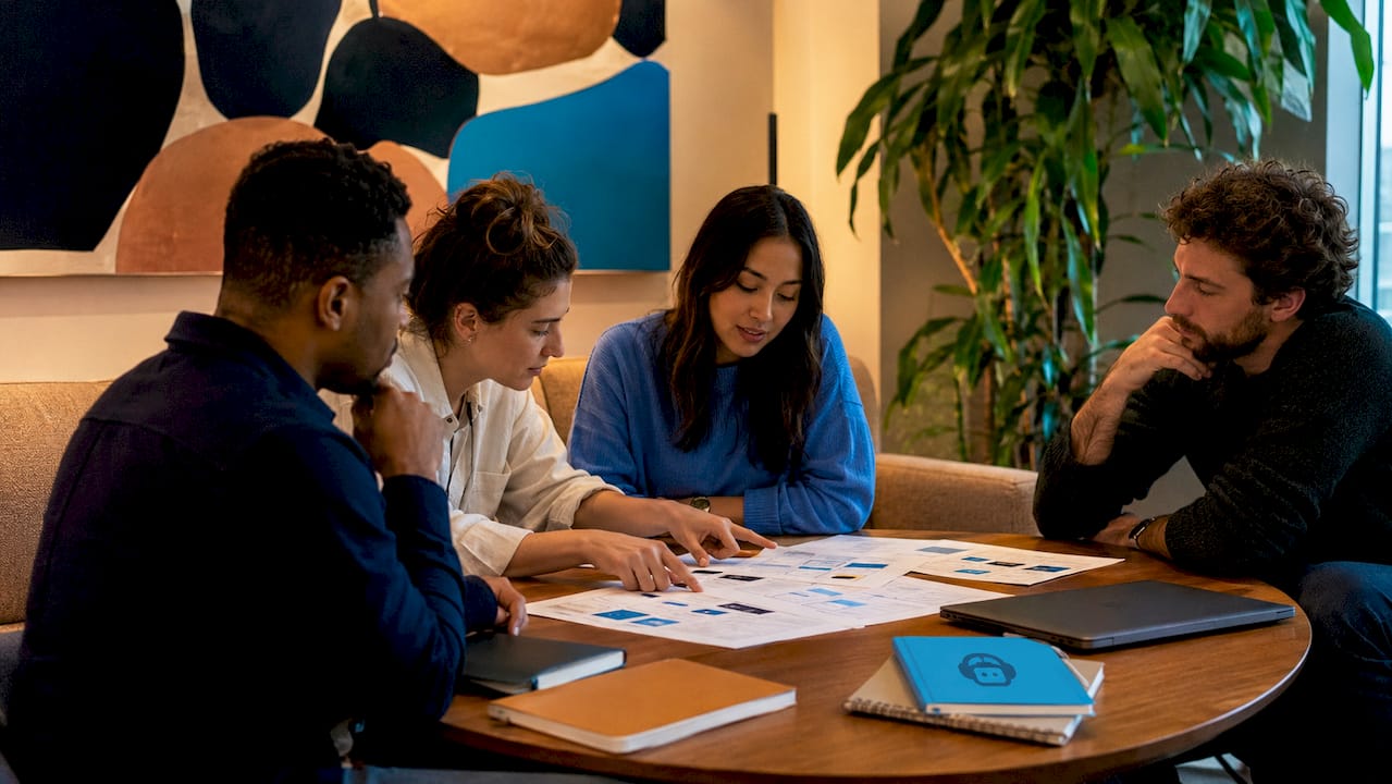 website budget plan: your 2026 small business guide 3 team discussing website budget plan collaboratively