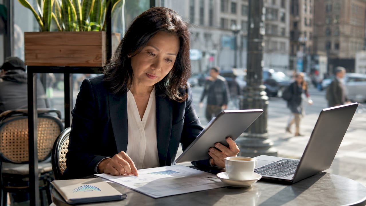 Businesswoman reviewing finances in office