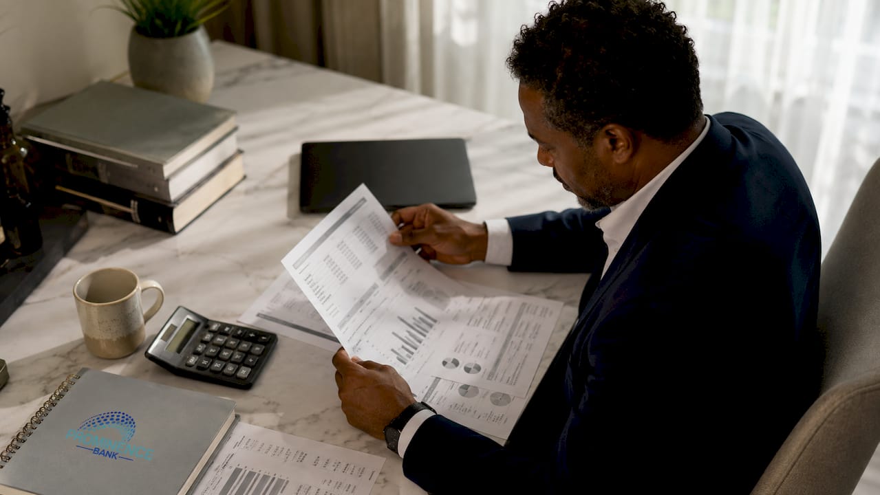 Wealth manager reviewing financial documents