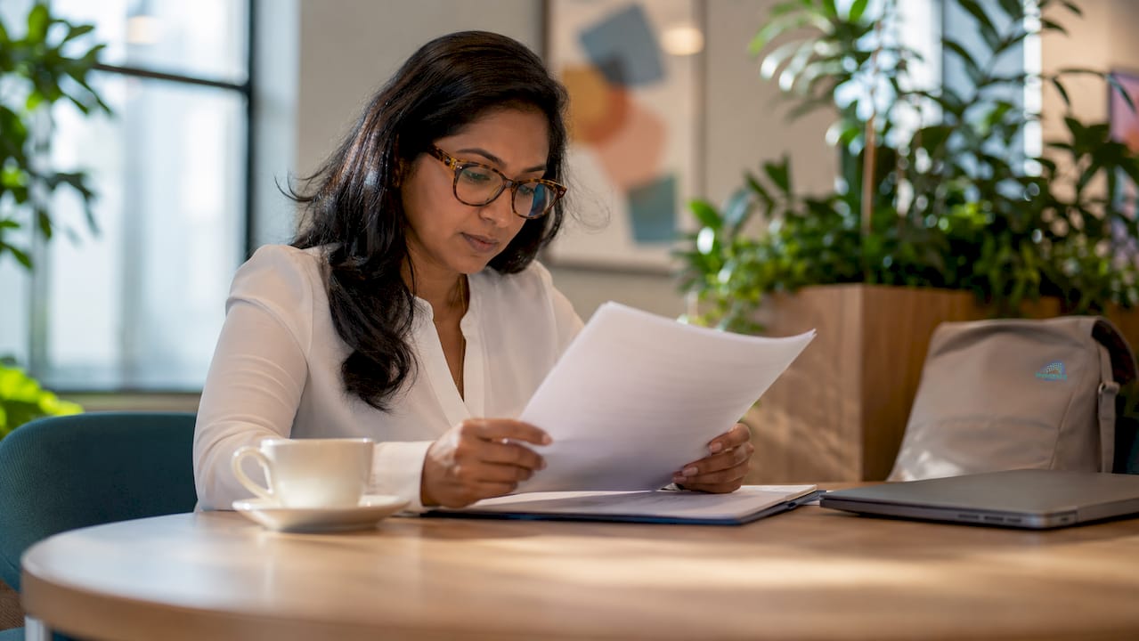 Compliance officer reviewing banking regulations