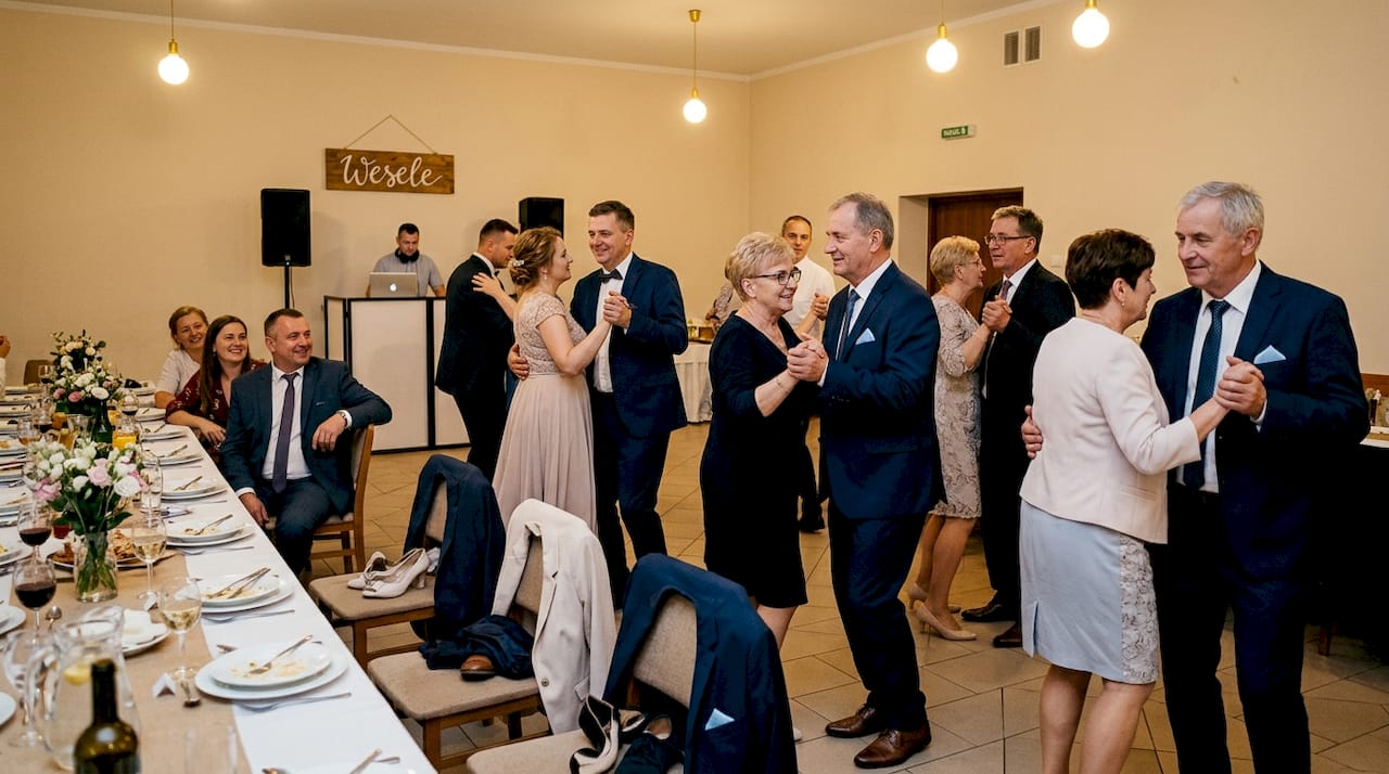 Wedding guests dancing group salsa together