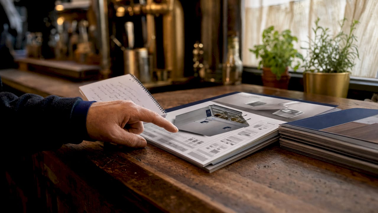 Hands reviewing energy-efficient appliance details