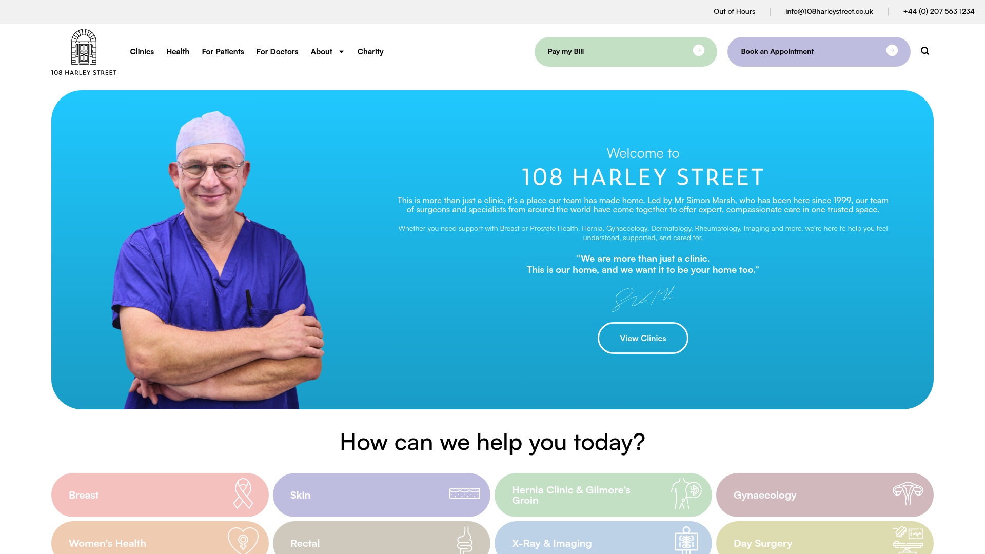 Surgeon in scrubs smiling against a blue background, representing 108 Harley Street clinic, emphasizing personalized patient care and specialist services in London.