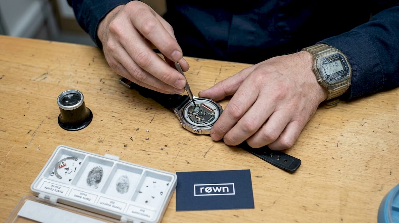 Technician replacing a quartz watch battery