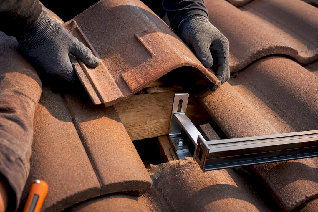 Tile-bypass hook beneath clay roof tile