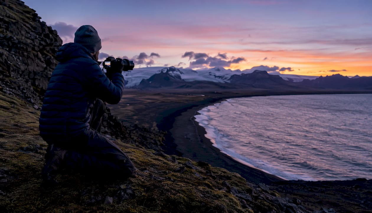 Photographer scouting remote Iceland location in daylight