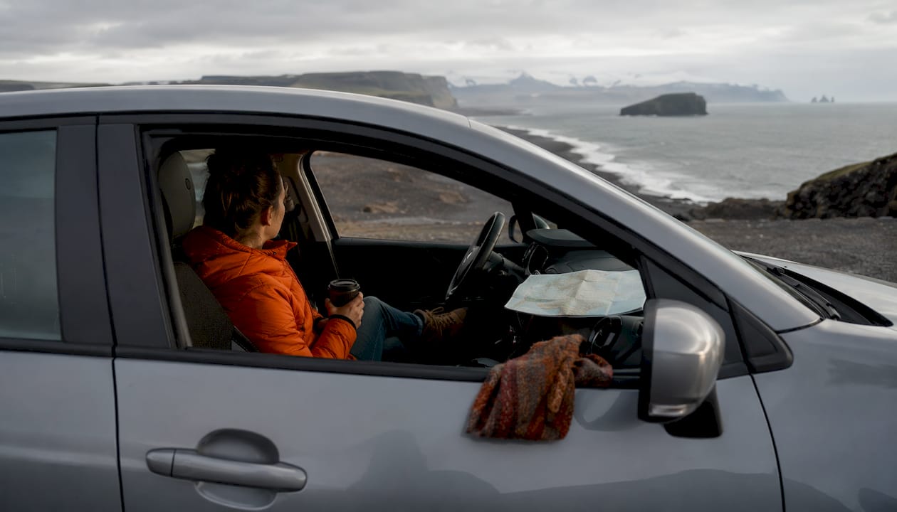 Solo traveler in rental car on Iceland Ring Road