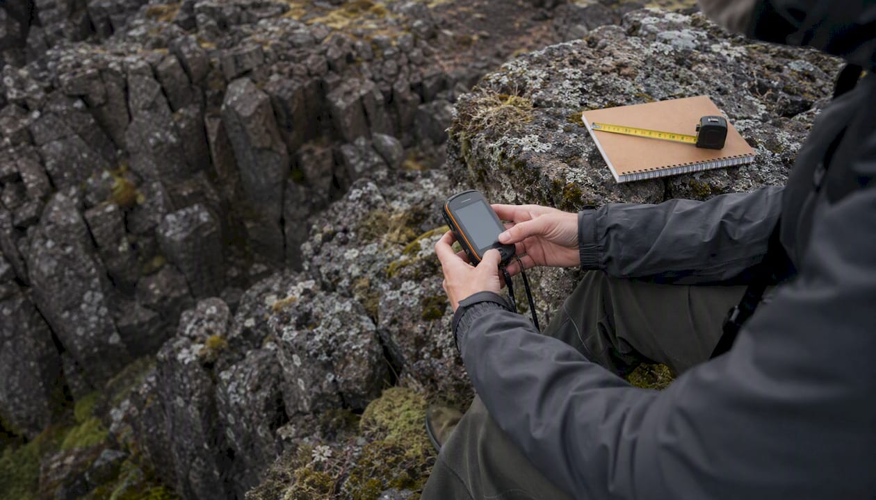 Intern using GPS for geology fieldwork